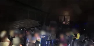 Hallan a 225 migrantes, 14 son hondureños, en bodega en céntrico Estado de México